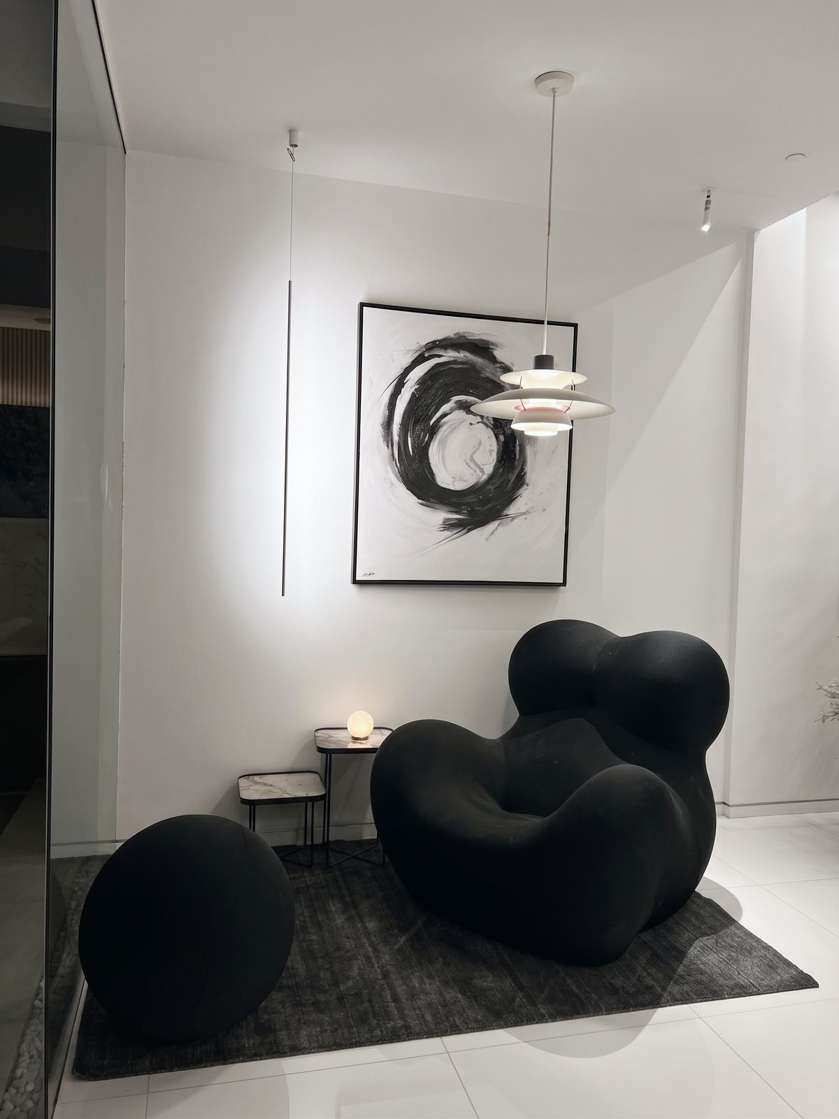Living room — green leather sofa against a Calacatta Viola wall
